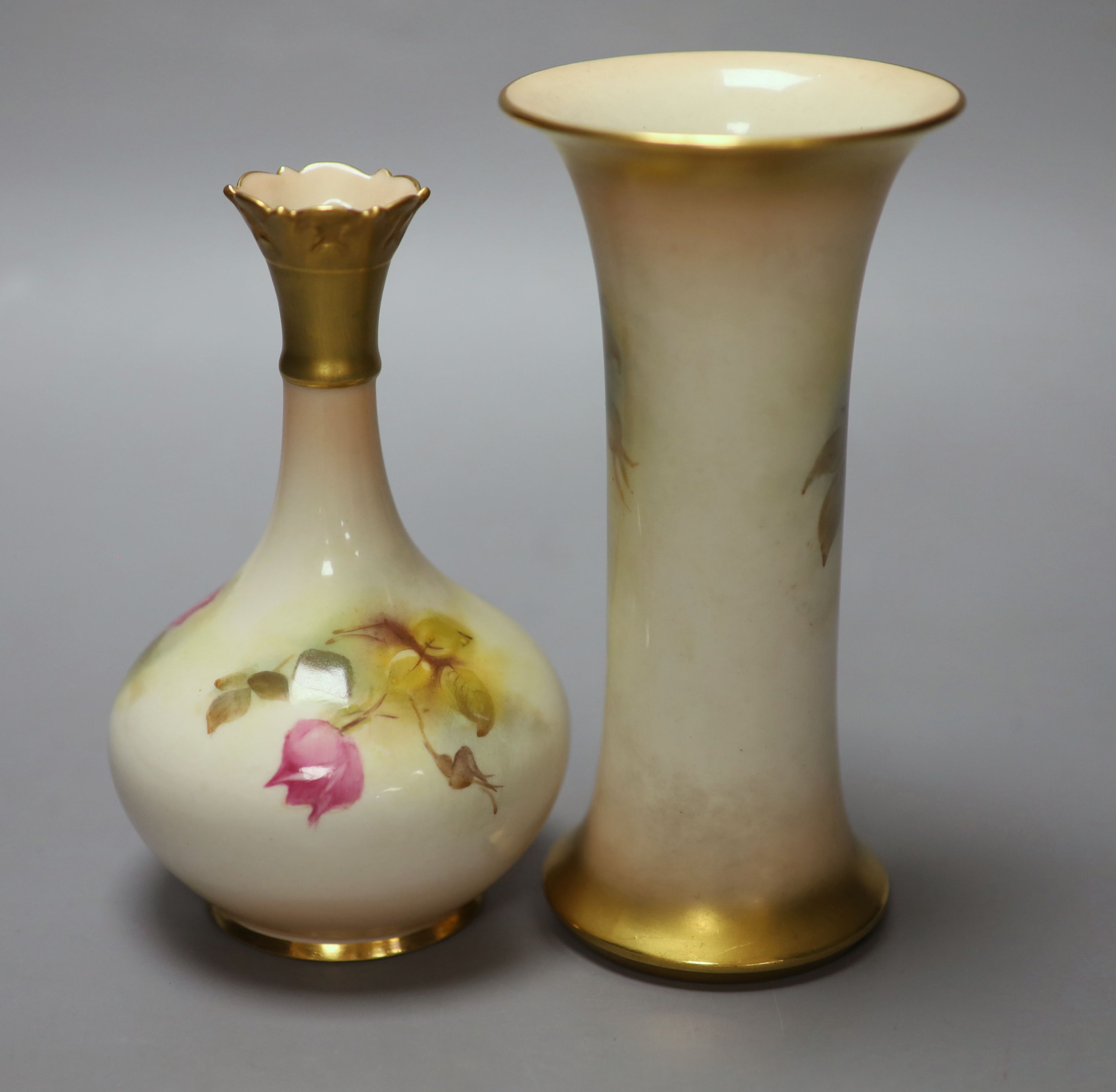 A Royal Worcester trumpet vase, shape G923 painted with roses by M. Hunt, signed, date code 1925 and another vase, shape G702 painted w